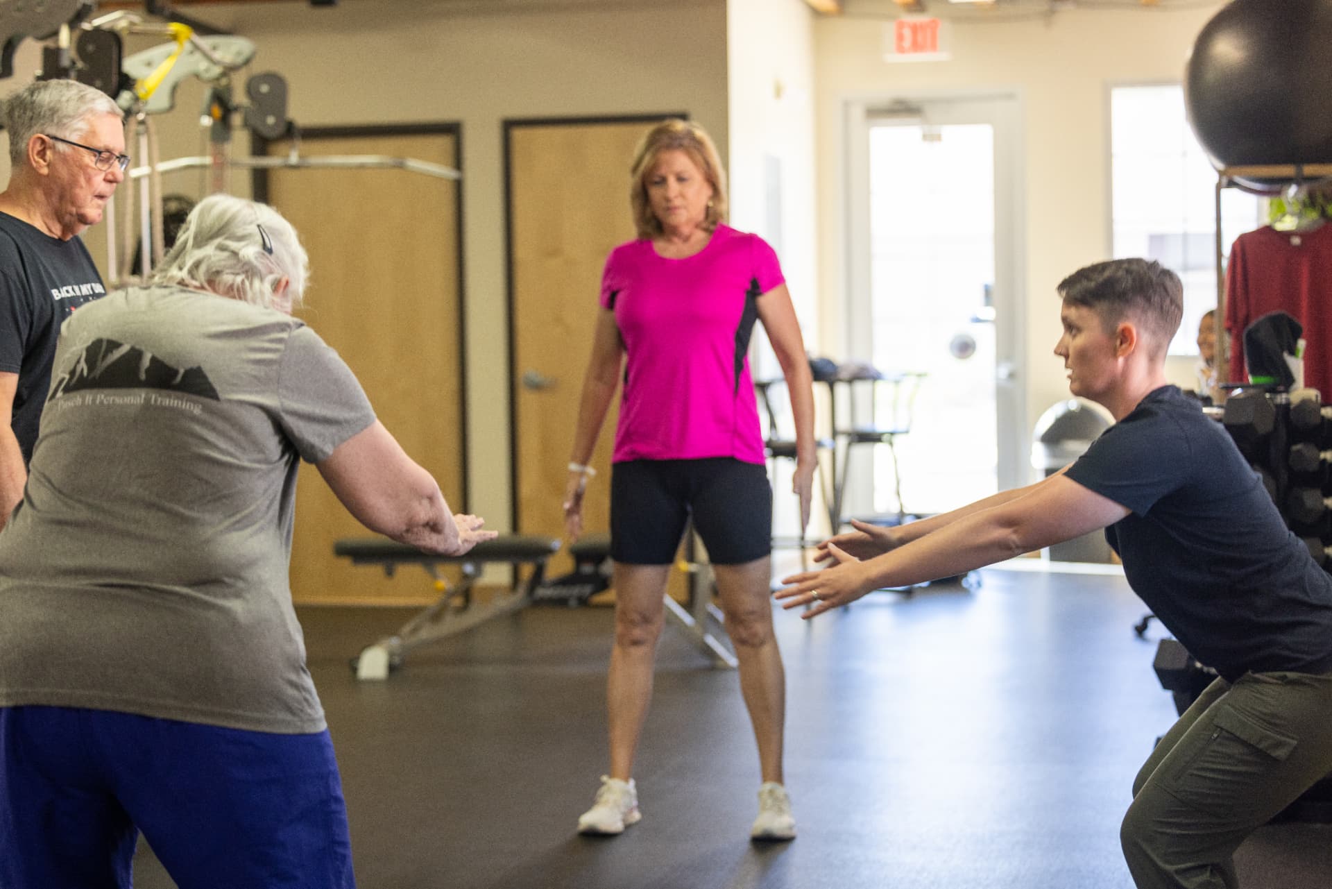 Amber coaching a small group strength and balance class